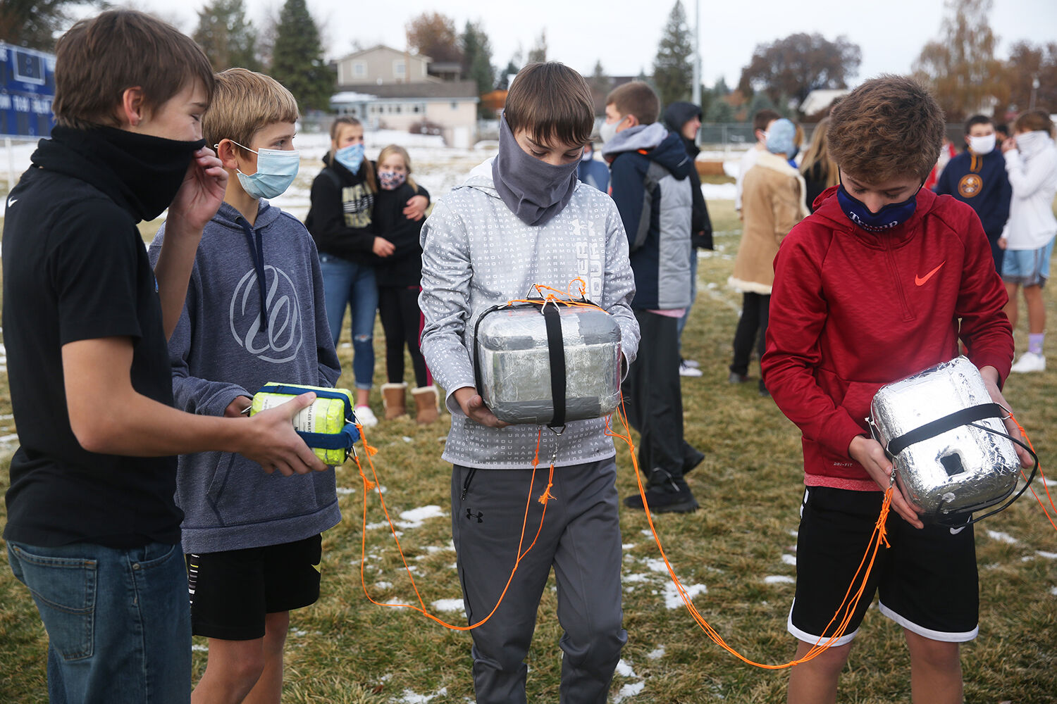 Cole Rasmussen, Zach Freise, Ryan Rasmussen and Jeron Sutten help carry the different hanging components